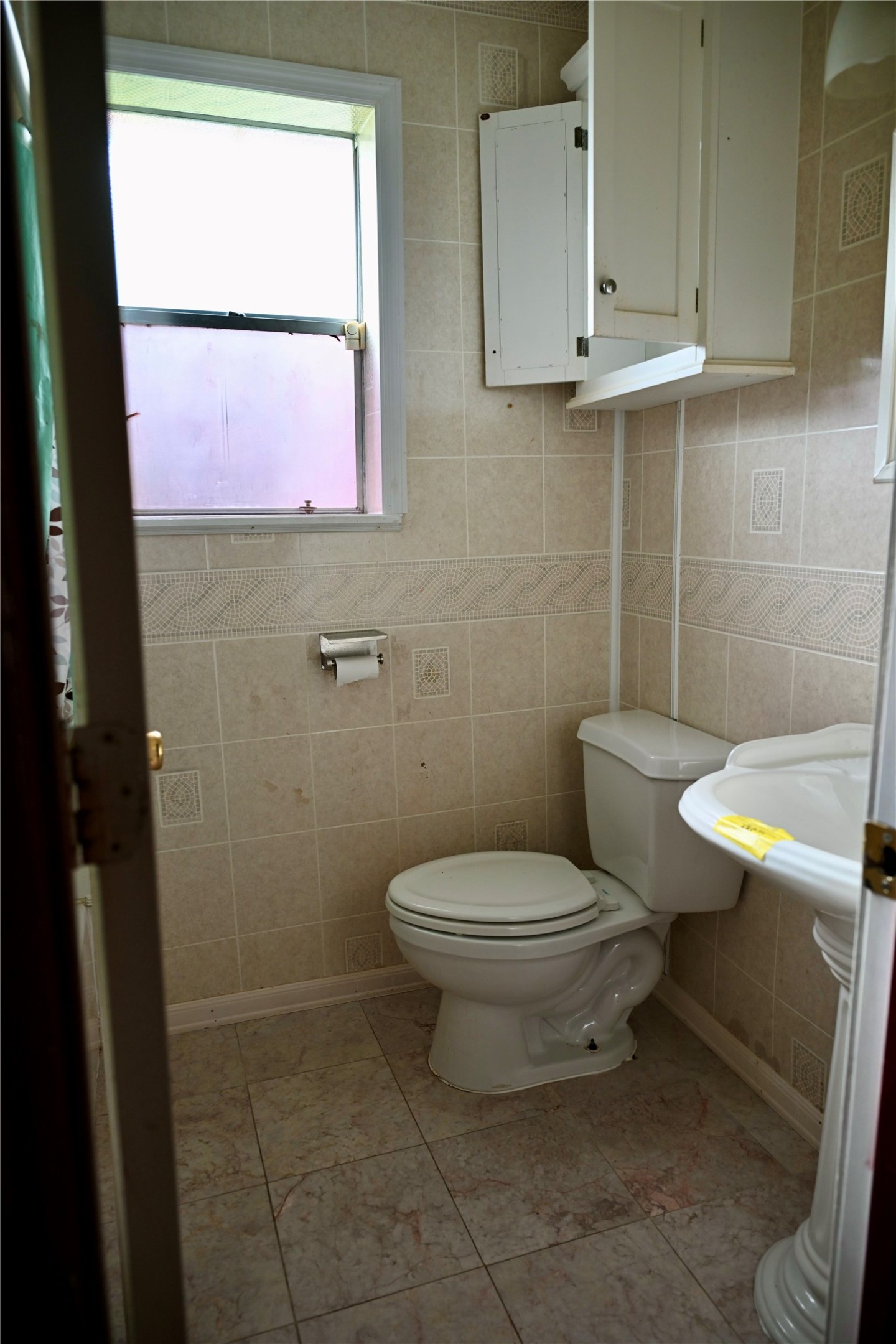 252 Bastrop Street Angleton, TX 77515 - Photo 24 of 28 a bathroom with a toilet a sink and a mirror
