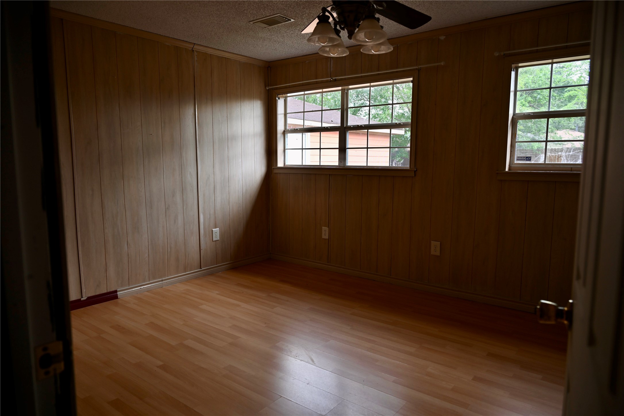 252 Bastrop Street Angleton, TX 77515 - Photo 27 of 28 an empty room with wooden floor and windows