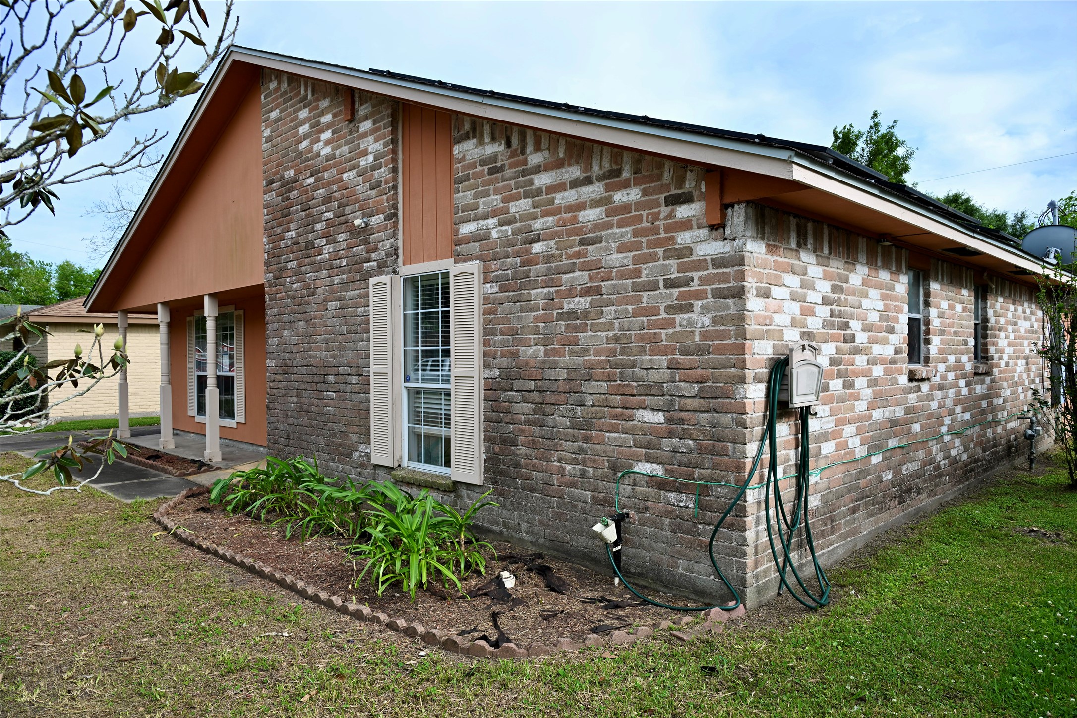 252 Bastrop Street Angleton, TX 77515 - Photo 7 of 28 a front view of a house with garden