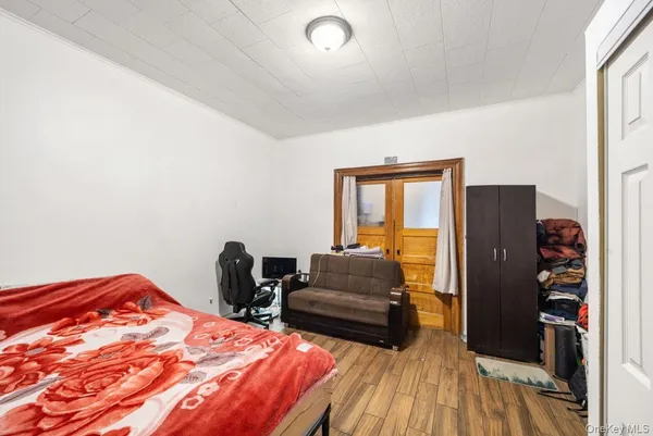 a bedroom with a bed and a couch