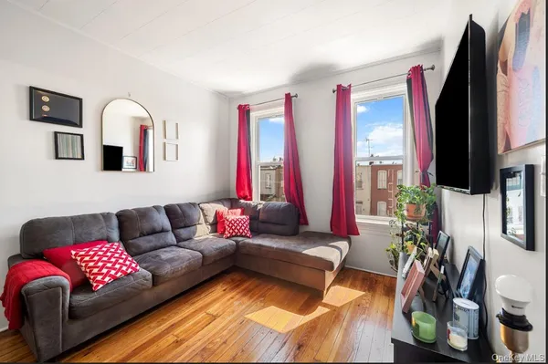 a living room with furniture fireplace and flat screen tv