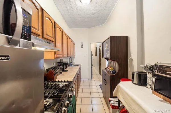 a view of a kitchen with appliances and cabinets