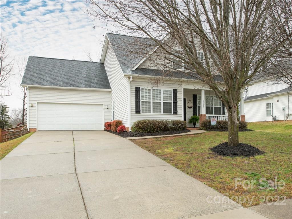 5725 Coopers Ridge Lane Charlotte, NC 28269 - Photo 1 of 39 a view of a house with a yard