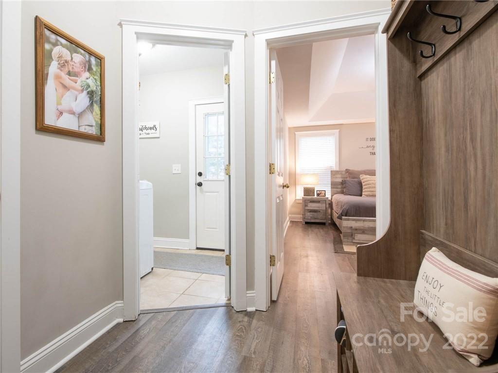 5725 Coopers Ridge Lane Charlotte, NC 28269 - Photo 18 of 39 a view of a hallway view with wooden floor and furniture