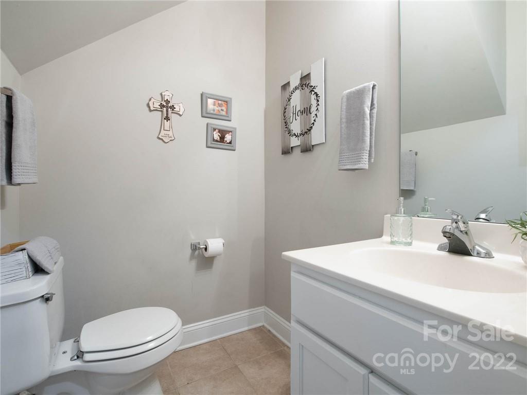 5725 Coopers Ridge Lane Charlotte, NC 28269 - Photo 19 of 39 a bathroom with a sink and a toilet
