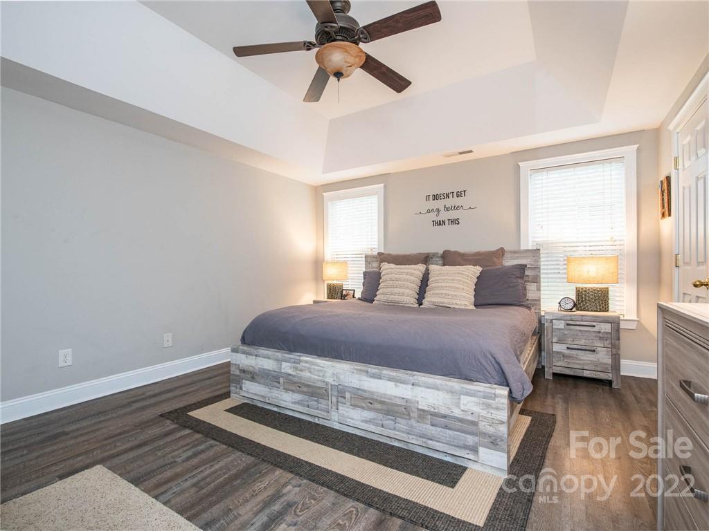 5725 Coopers Ridge Lane Charlotte, NC 28269 - Photo 21 of 39 a bedroom with a bed and window