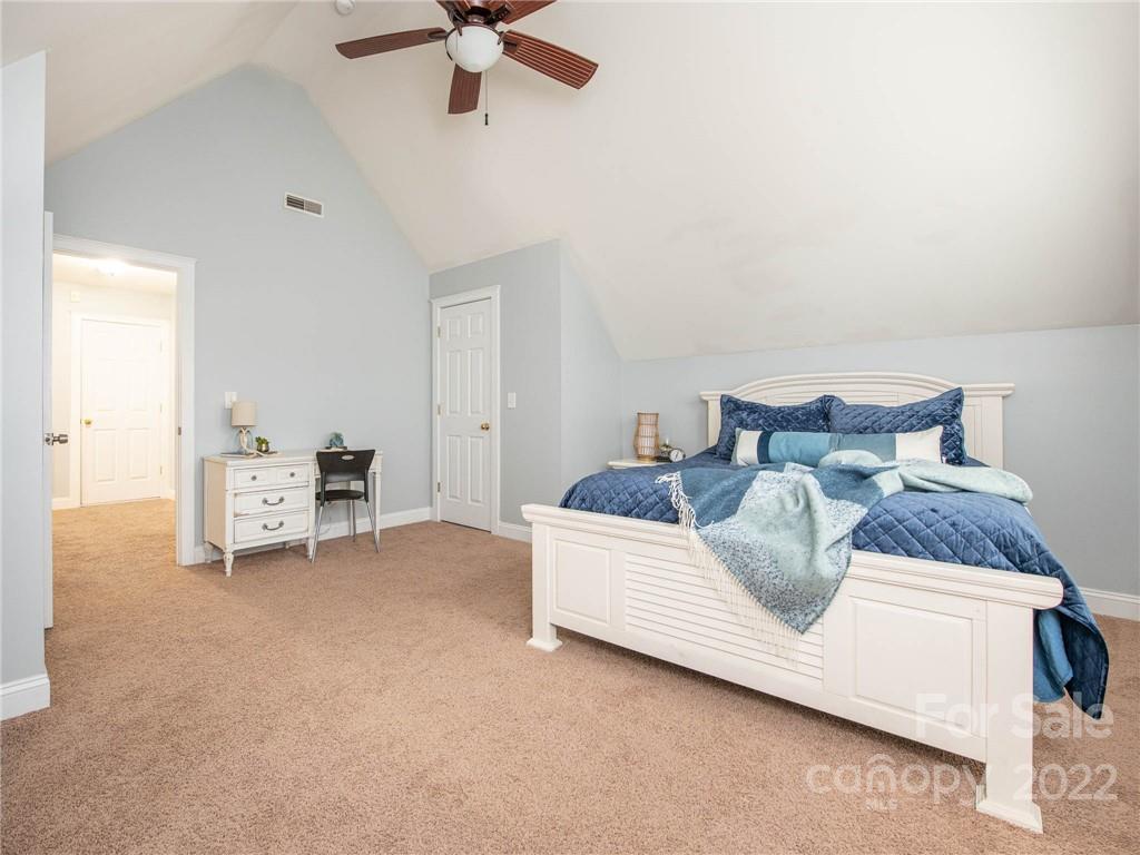 5725 Coopers Ridge Lane Charlotte, NC 28269 - Photo 34 of 39 a living room with furniture and a ceiling fan