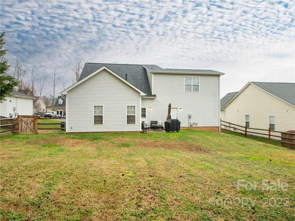 5725 Coopers Ridge Lane Charlotte, NC 28269 - Photo 38 of 39 a view of a house with a yard