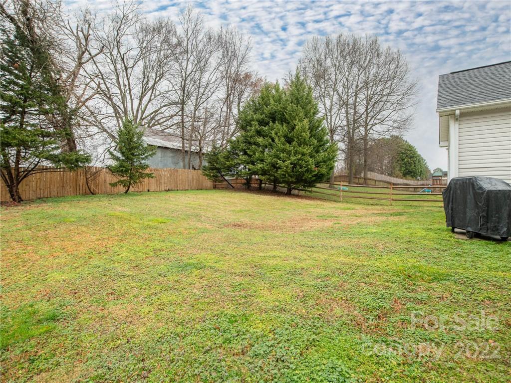 5725 Coopers Ridge Lane Charlotte, NC 28269 - Photo 39 of 39 a view of a swimming pool with an outdoor space and seating area