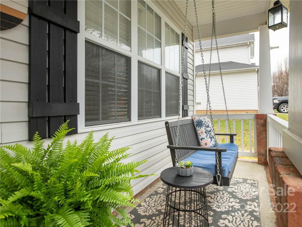 5725 Coopers Ridge Lane Charlotte, NC 28269 - Photo 4 of 39 a view of a chair and tables in the balcony