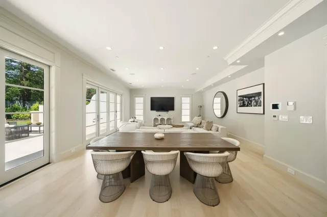 a white bath tub sitting in a bathroom next to a window