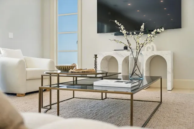 a spacious bedroom with a bed and a couch