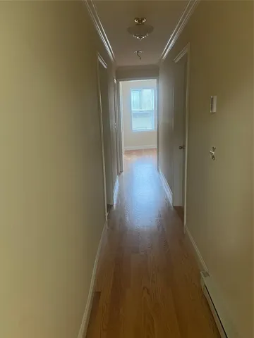 a hallway with wooden floor