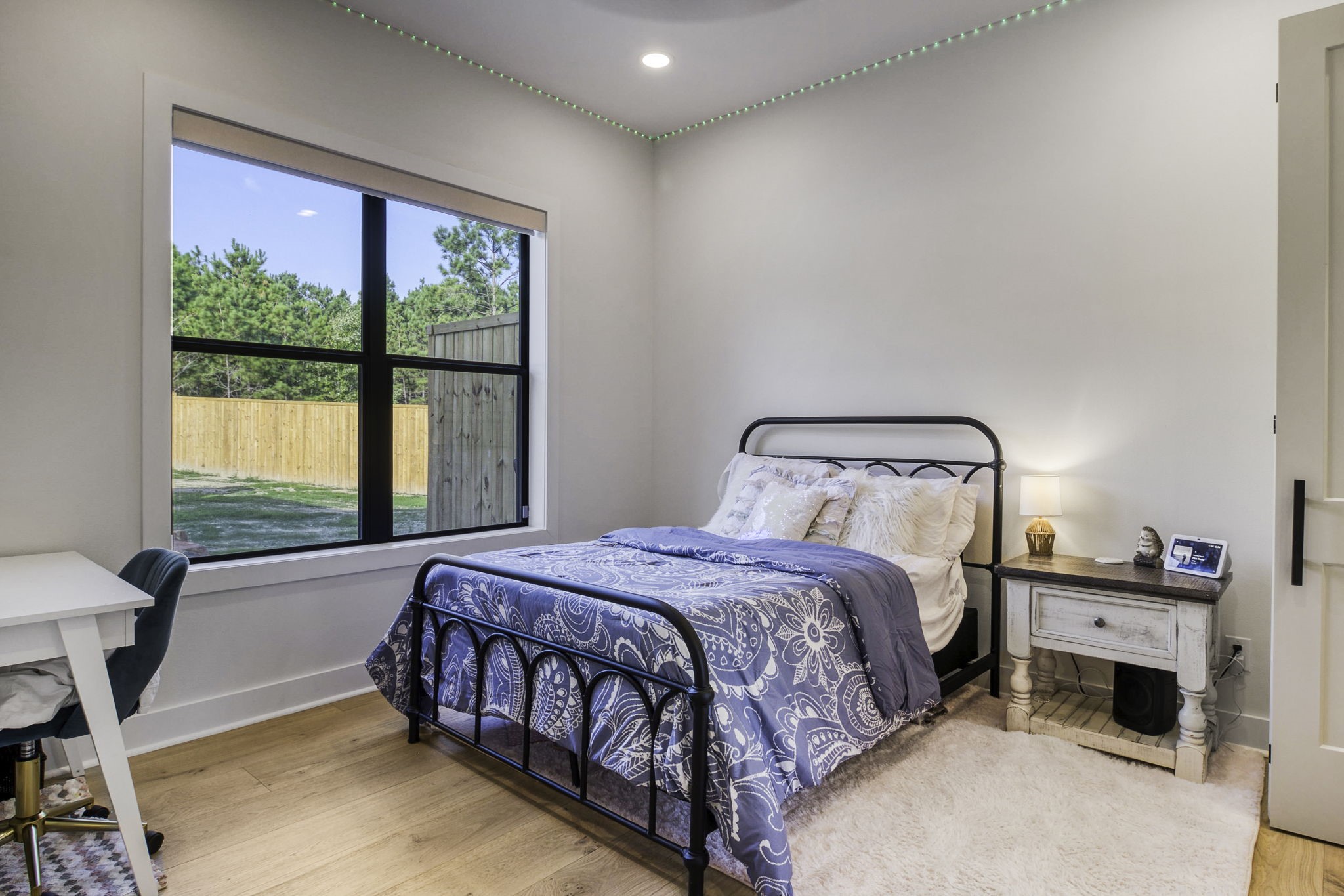 4602 Fm 3459 Road Onalaska, TX 77360 - Photo 28 of 45 a bedroom with a bed and a window