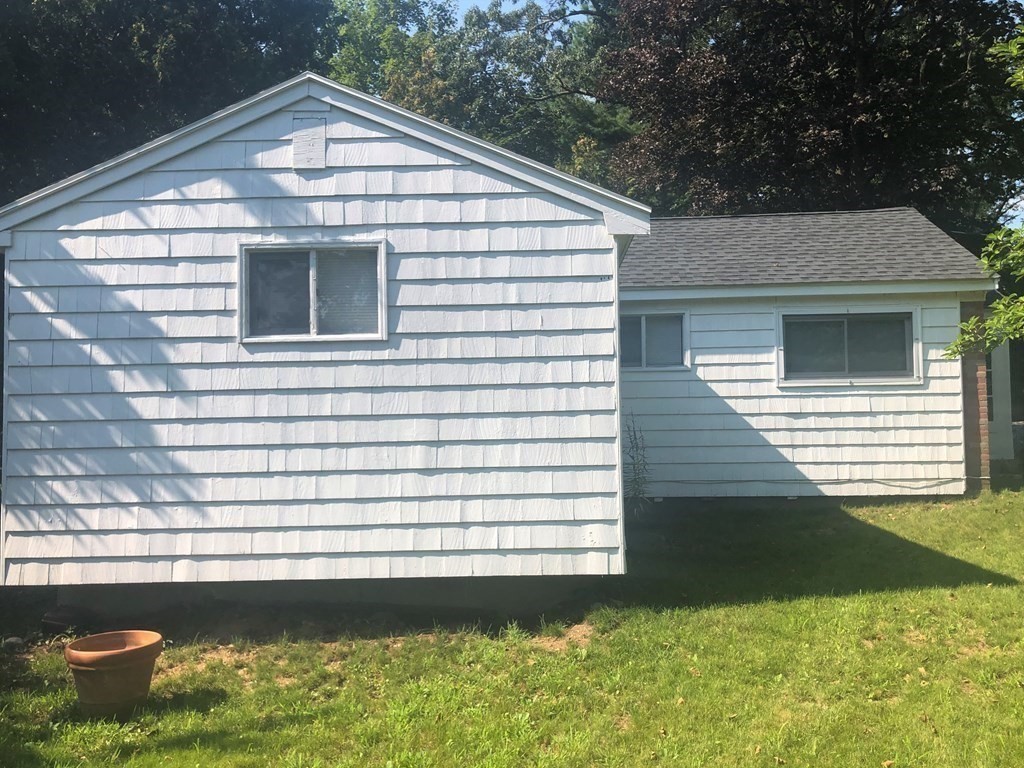 14 Rodgers Circle, Unit REAR North Reading, MA 01864 - Photo 2 of 8 a view of a house with a yard
