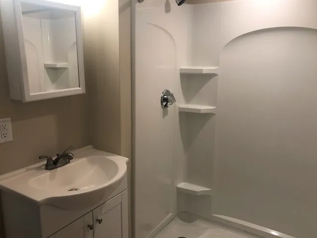 a bathroom with a sink toilet and vanity
