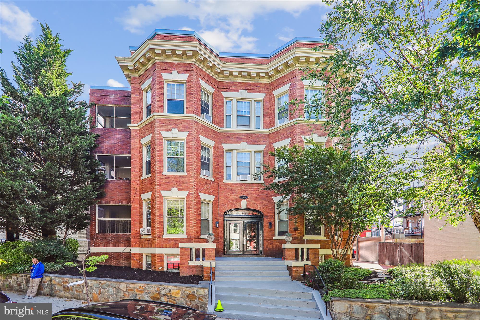 a front view of a multi story residential apartment buildings