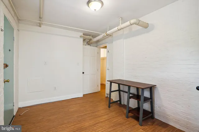 a view of entryway with wooden floor
