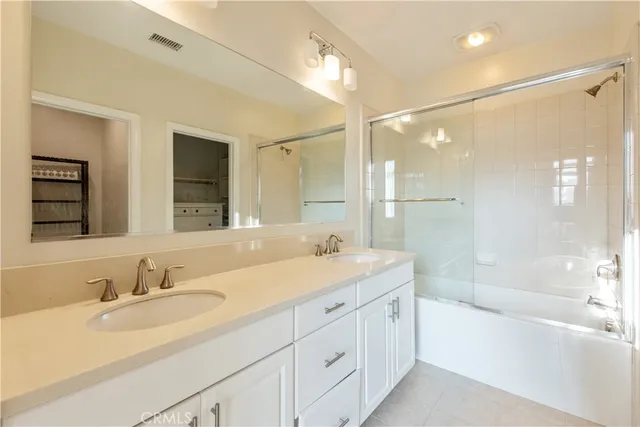 a bathroom with a sink a toilet and bathtub