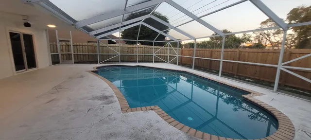a view of balcony with wooden floor and outdoor seating