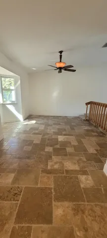 a view of a room with rack and wooden floor