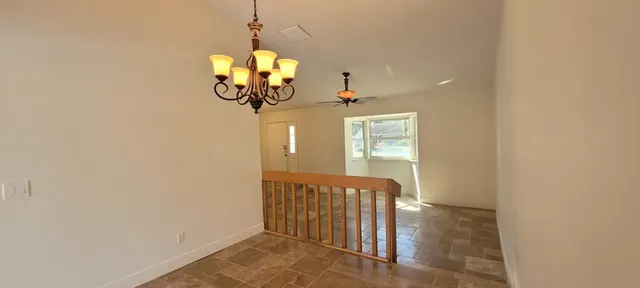 a view of a hallway with windows