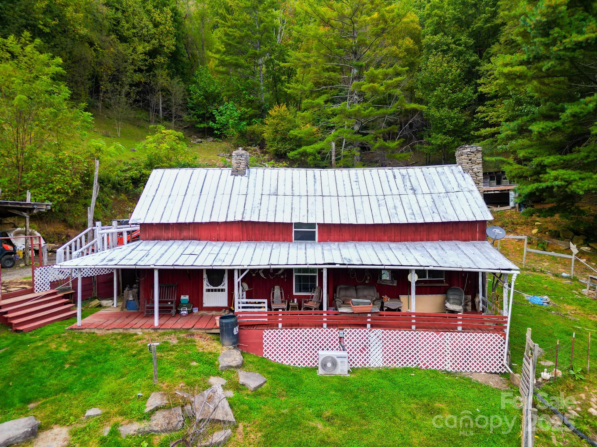 105 Home Place Road Maggie Valley, NC 28751 - Photo 1 of 24 swimming pool view with a seating space and garden