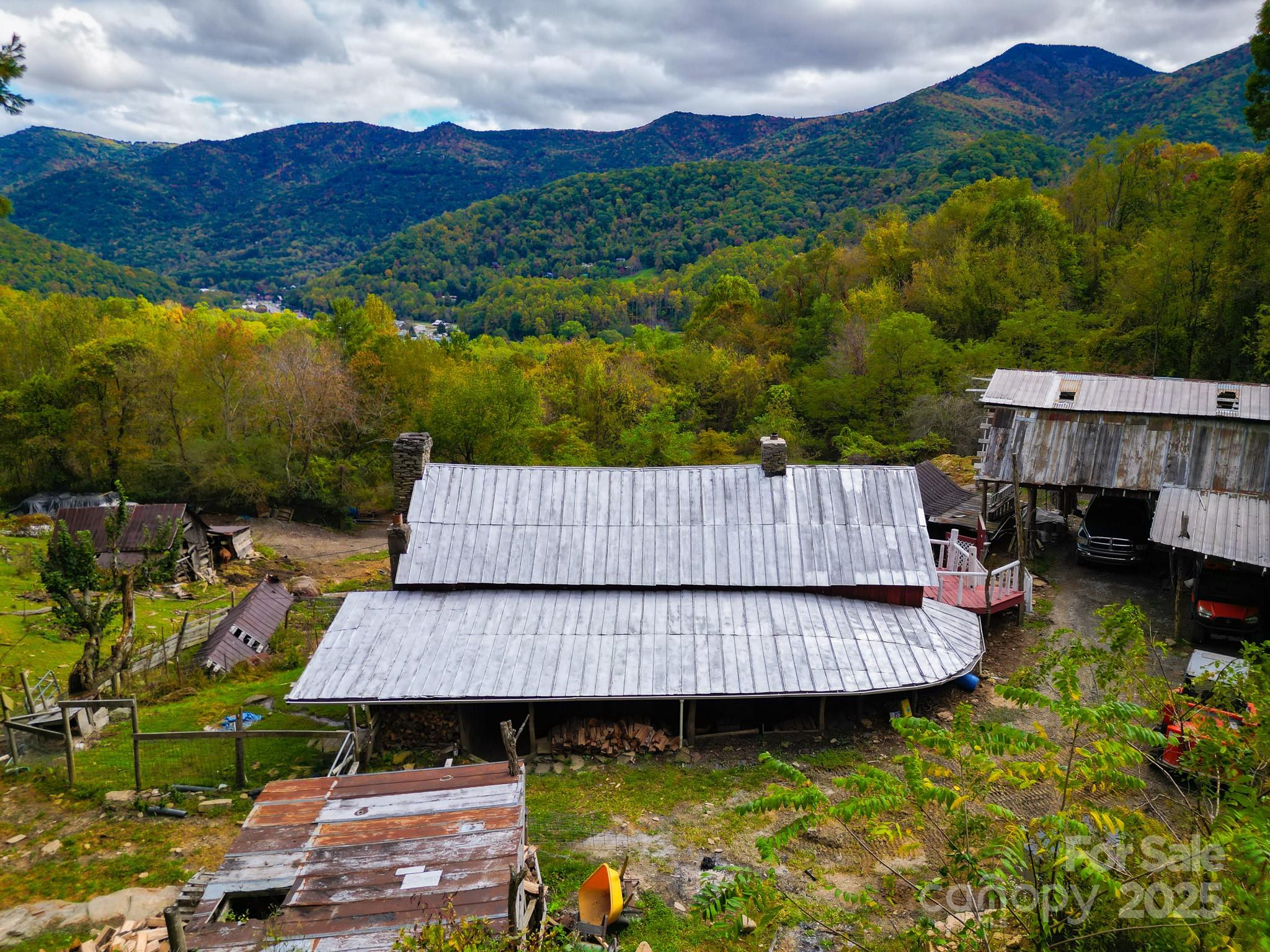 105 Home Place Road Maggie Valley, NC 28751 - Photo 13 of 24 an aerial view of a house with swimming pool and a yard