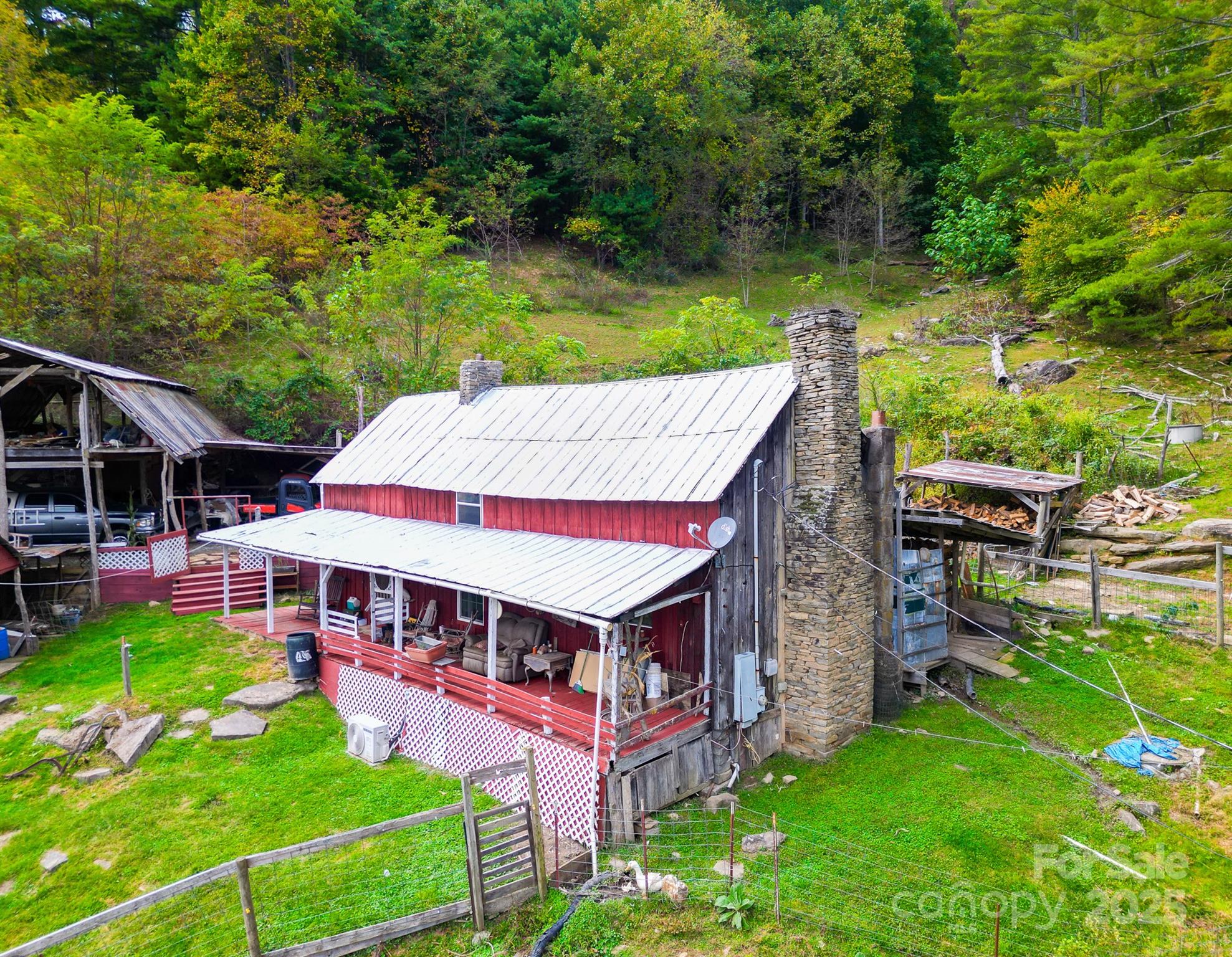 105 Home Place Road Maggie Valley, NC 28751 - Photo 15 of 24 an aerial view of a house with swimming pool garden and patio