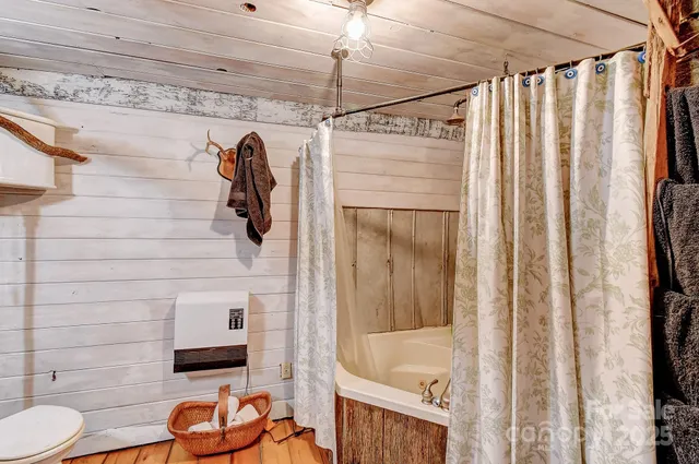 a bathroom with a shower curtain and a sink