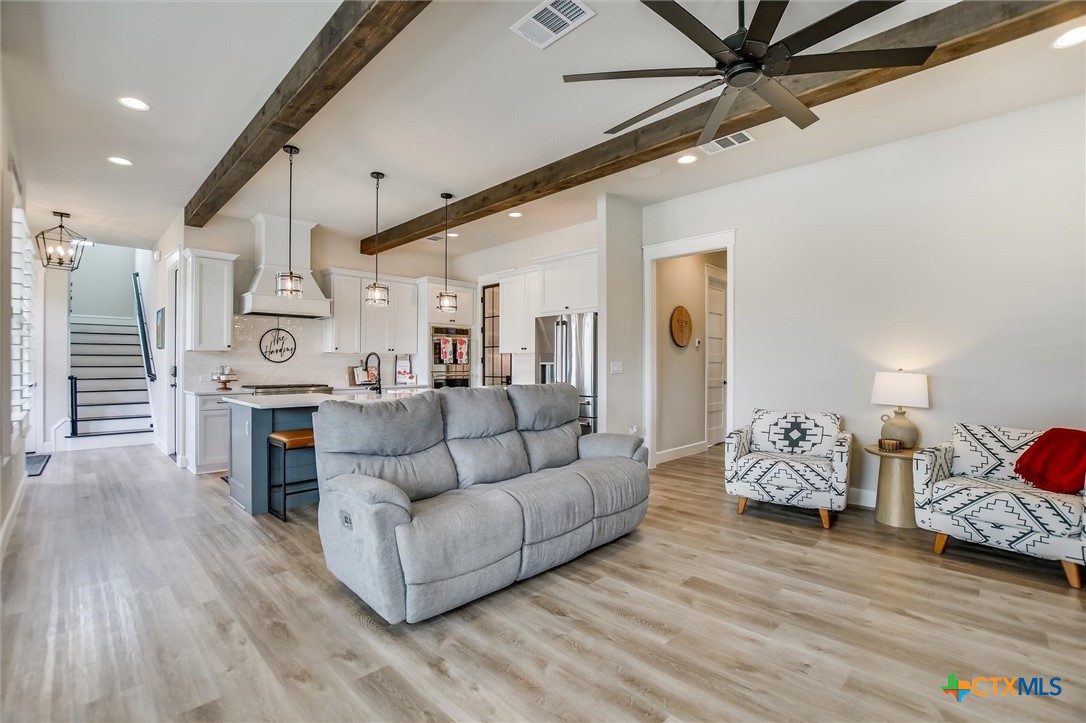 105 Retreat Place Georgetown, TX 78626 - Photo 42 of 42 a living room with furniture and a wooden floor
