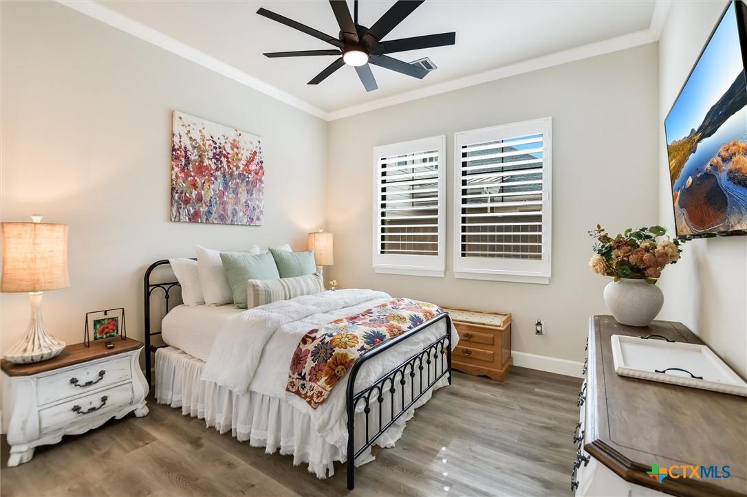 105 Retreat Place Georgetown, TX 78626 - Photo 20 of 42 a bedroom with a bed and a window
