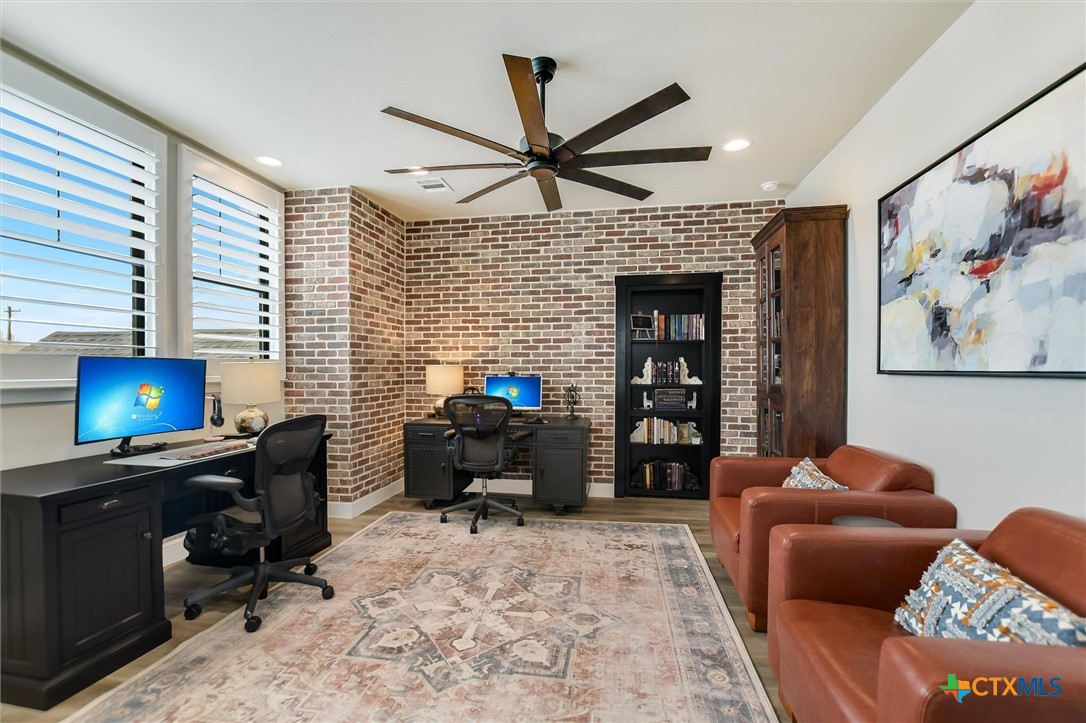 105 Retreat Place Georgetown, TX 78626 - Photo 24 of 42 a livingroom with workspace and a window