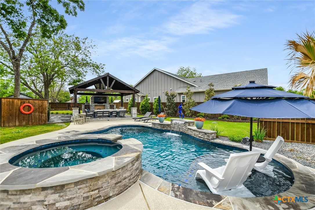 105 Retreat Place Georgetown, TX 78626 - Photo 25 of 42 a view of a house with swimming pool and sitting area