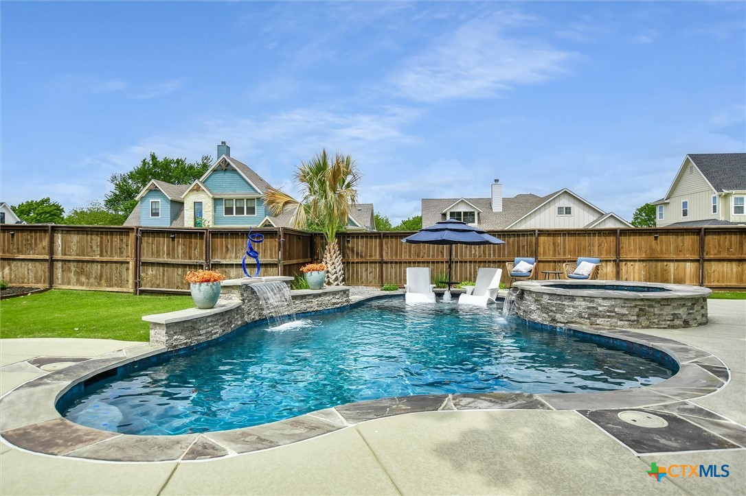 105 Retreat Place Georgetown, TX 78626 - Photo 30 of 42 a view of a house with swimming pool and a yard