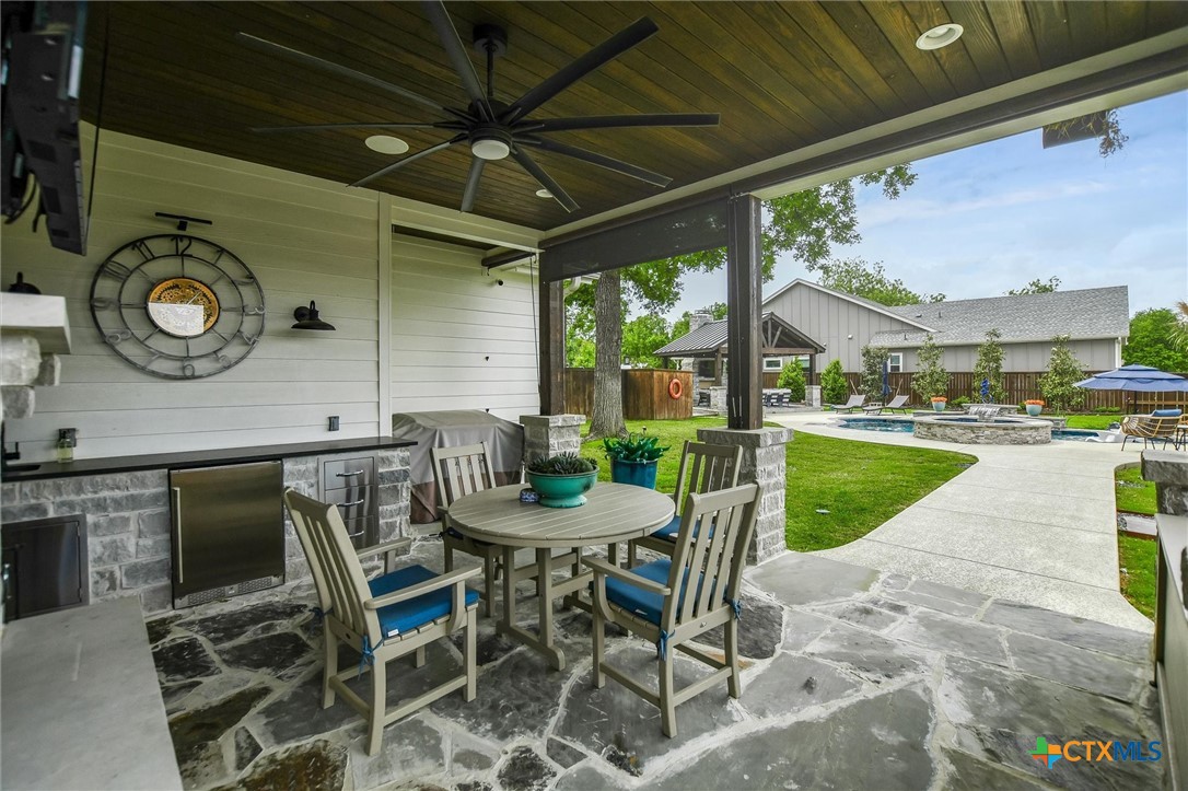 105 Retreat Place Georgetown, TX 78626 - Photo 40 of 42 a view of a porch with furniture and a table