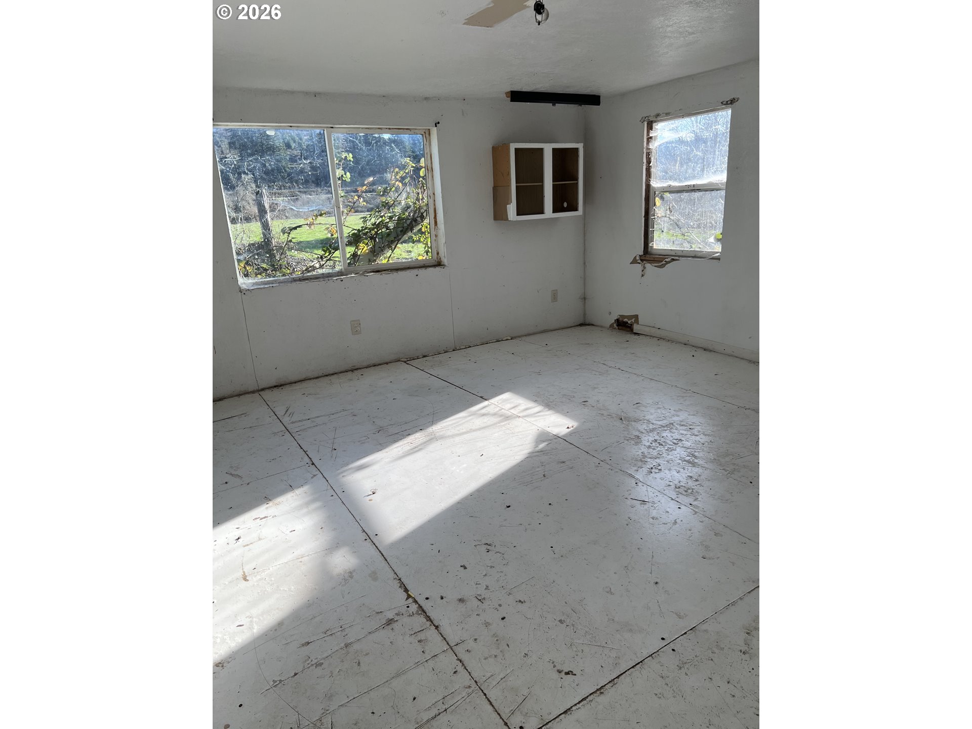 1161 Curtin Road Cottage Grove, OR 97424 - Photo 27 of 34 a view of an empty room with windows