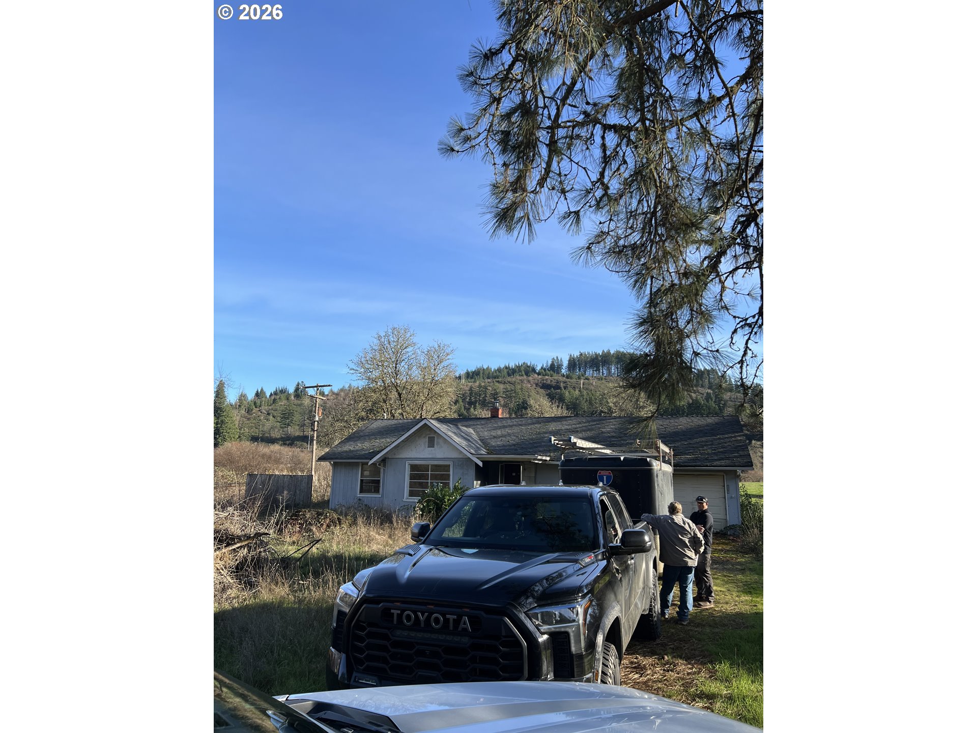 1161 Curtin Road Cottage Grove, OR 97424 - Photo 34 of 34 a view of a balcony with furniture and a potted plant