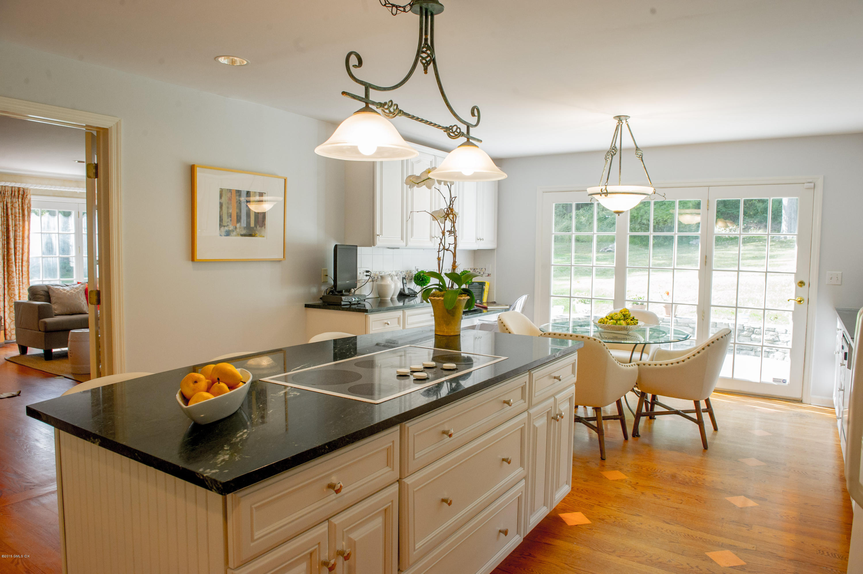 82 Butternut Hollow Road Greenwich, CT 06830 - Photo 12 of 29 a kitchen with a table chairs and white cabinets