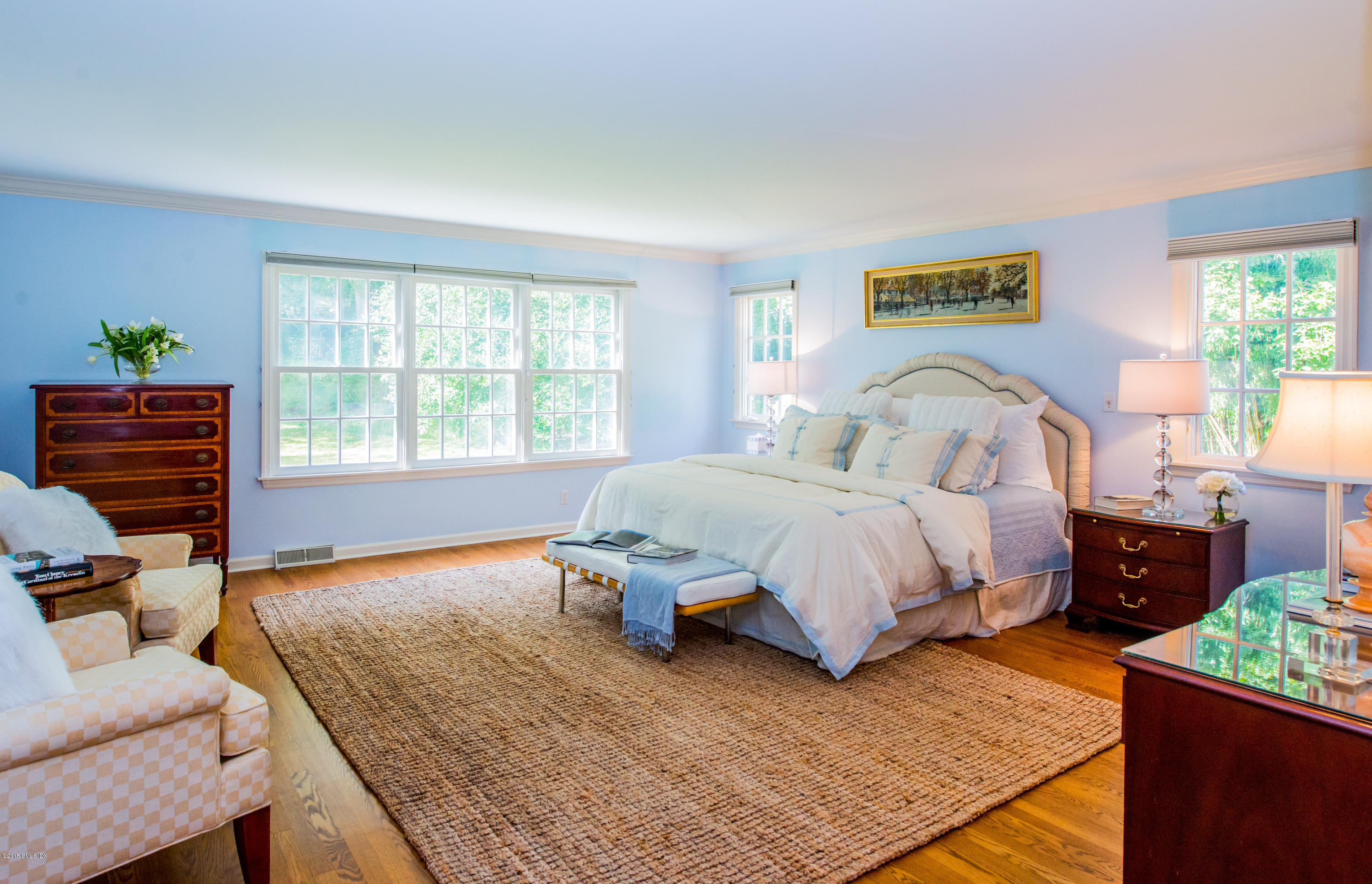 82 Butternut Hollow Road Greenwich, CT 06830 - Photo 16 of 29 a spacious bedroom with a bed and wooden floor