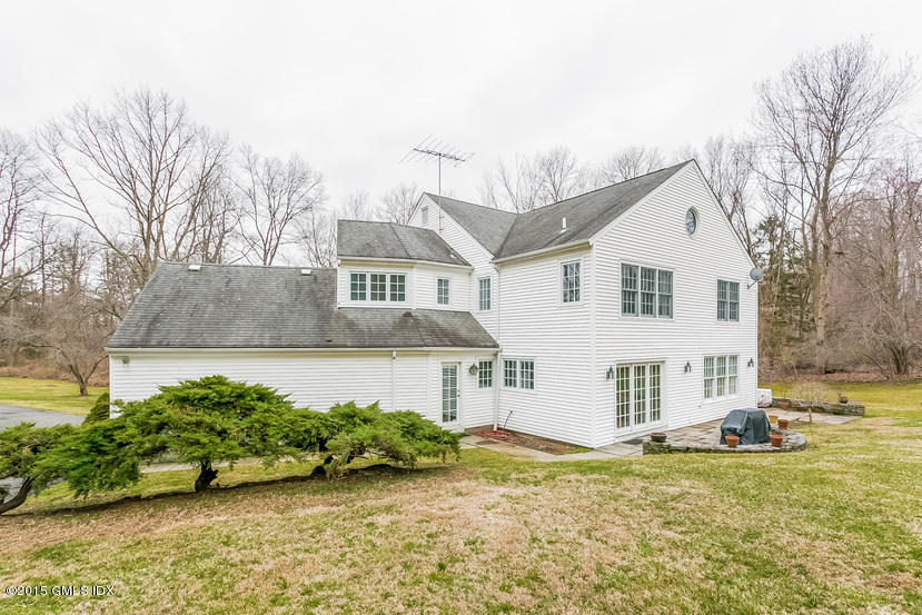 82 Butternut Hollow Road Greenwich, CT 06830 - Photo 23 of 29 a view of a house with a yard