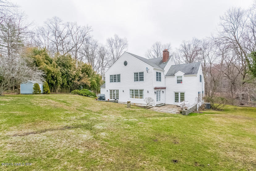 82 Butternut Hollow Road Greenwich, CT 06830 - Photo 24 of 29 a view of a house with a yard