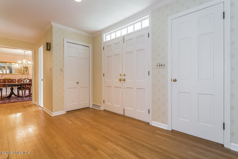 82 Butternut Hollow Road Greenwich, CT 06830 - Photo 3 of 29 an empty room with wooden floor and windows