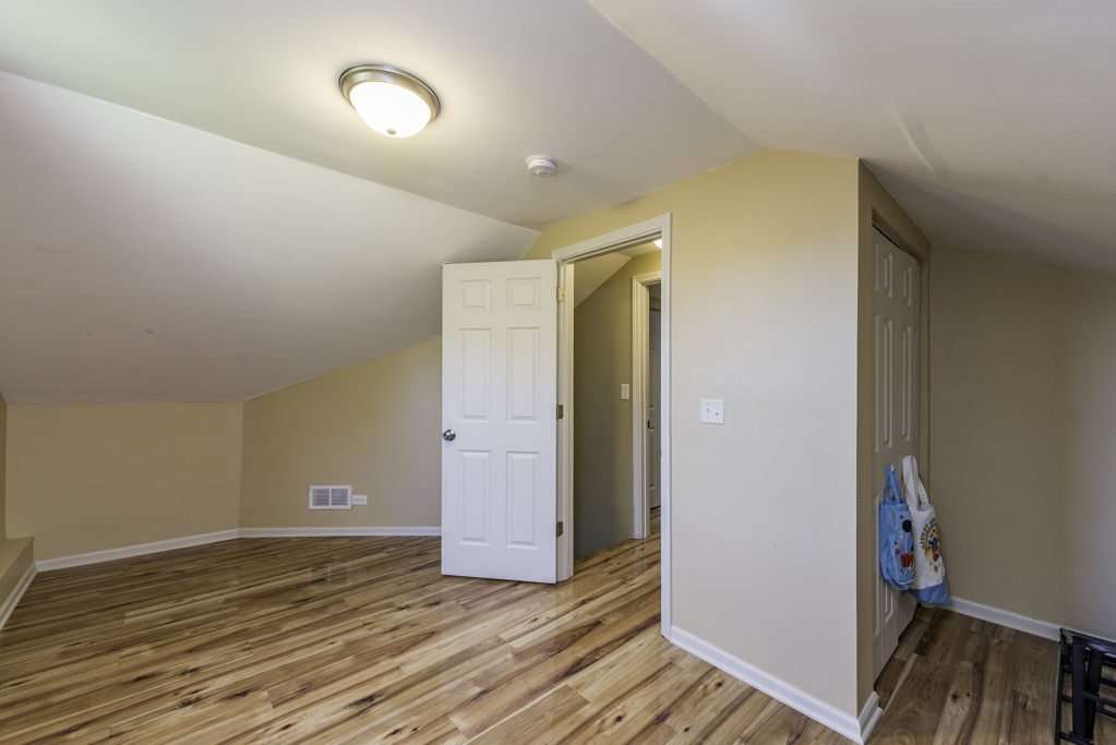 1700 Gideon Avenue Zion, IL 60099 - Photo 22 of 33 a view of an empty room with wooden floor