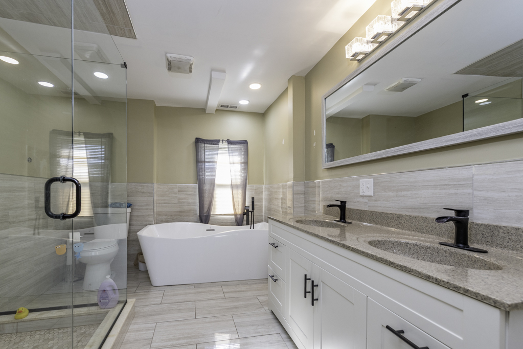 1700 Gideon Avenue Zion, IL 60099 - Photo 27 of 33 a bathroom with a double vanity sink and a mirror
