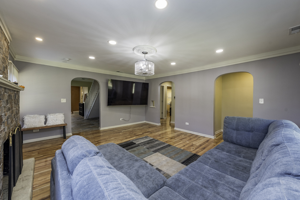 1700 Gideon Avenue Zion, IL 60099 - Photo 9 of 33 a living room with a couch and a fireplace
