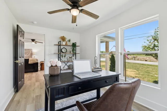 a view of a workspace with furniture