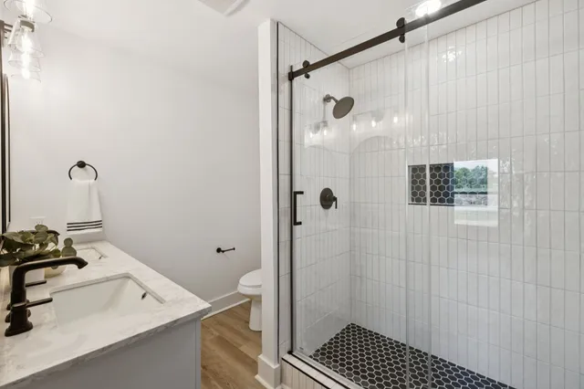 a bathroom with a sink and shower