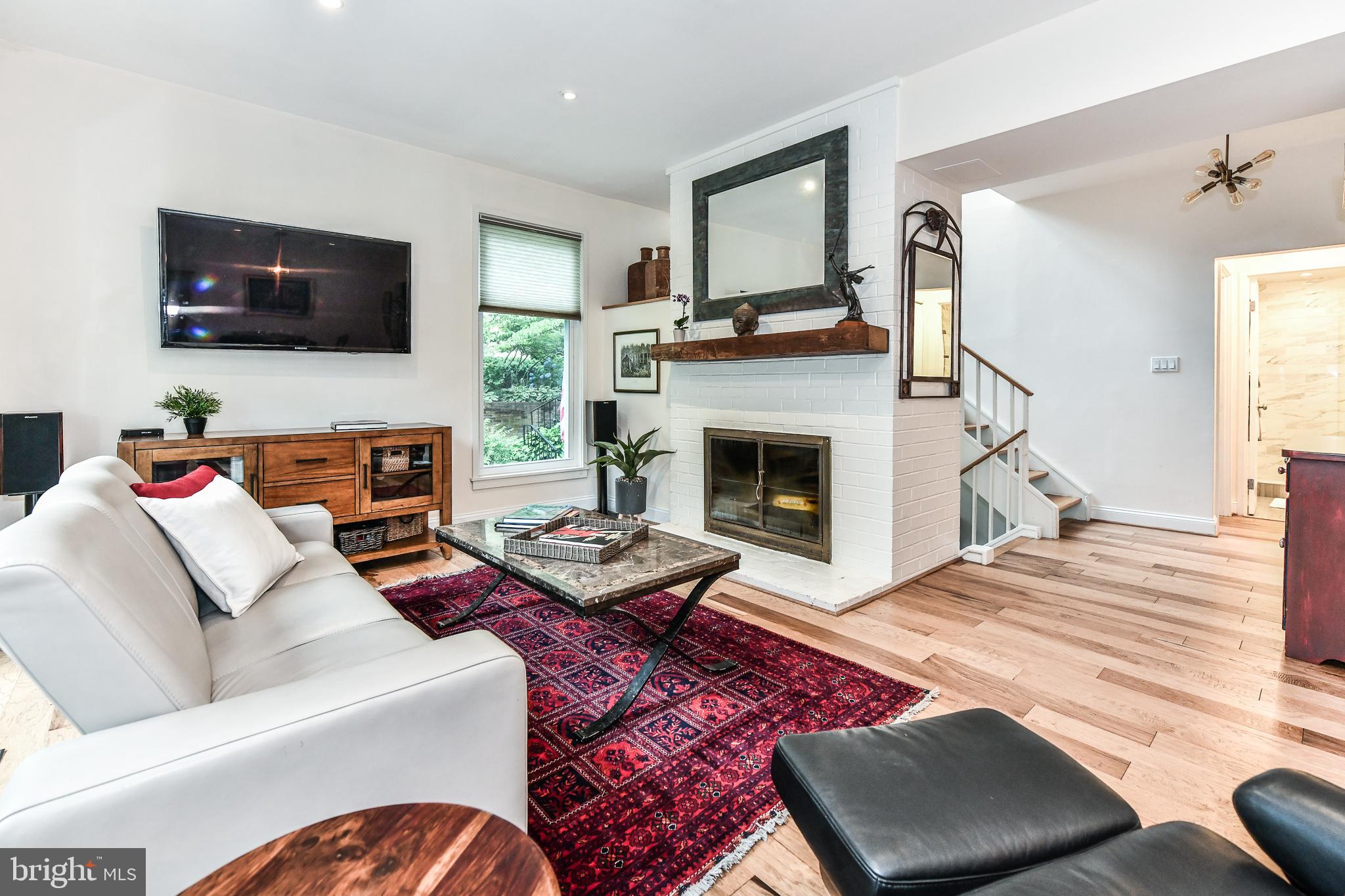 11485 Waterview Cluster Reston, VA 20190 - Photo 7 of 50 Living Room With Woodburning Fireplace