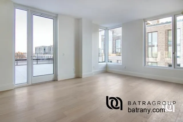 a view of an empty room and a window